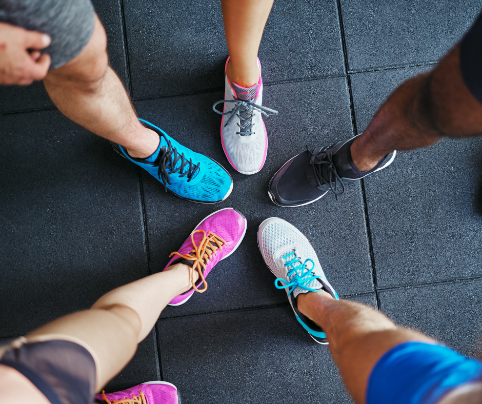 a group of runners showing their shoes