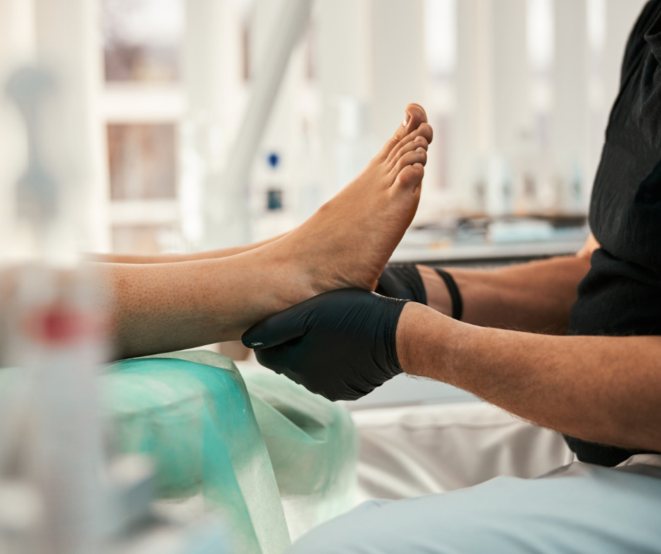 podiatrist holding foot